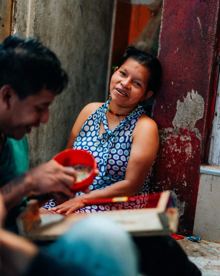 Embera woman at her house