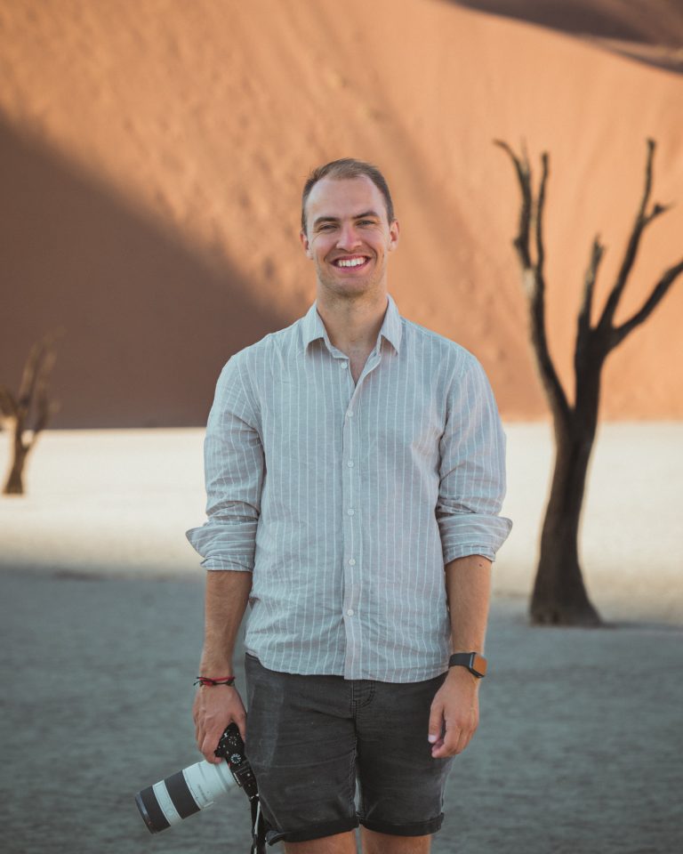 portrait shot of man holding a camera