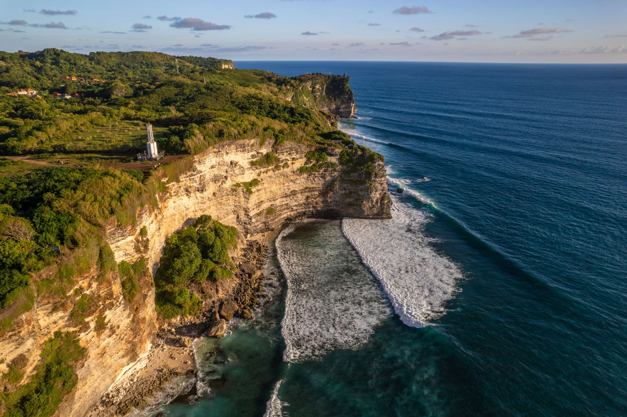 Ocean in southern Bali with Batu Jaran cliff in foreground
