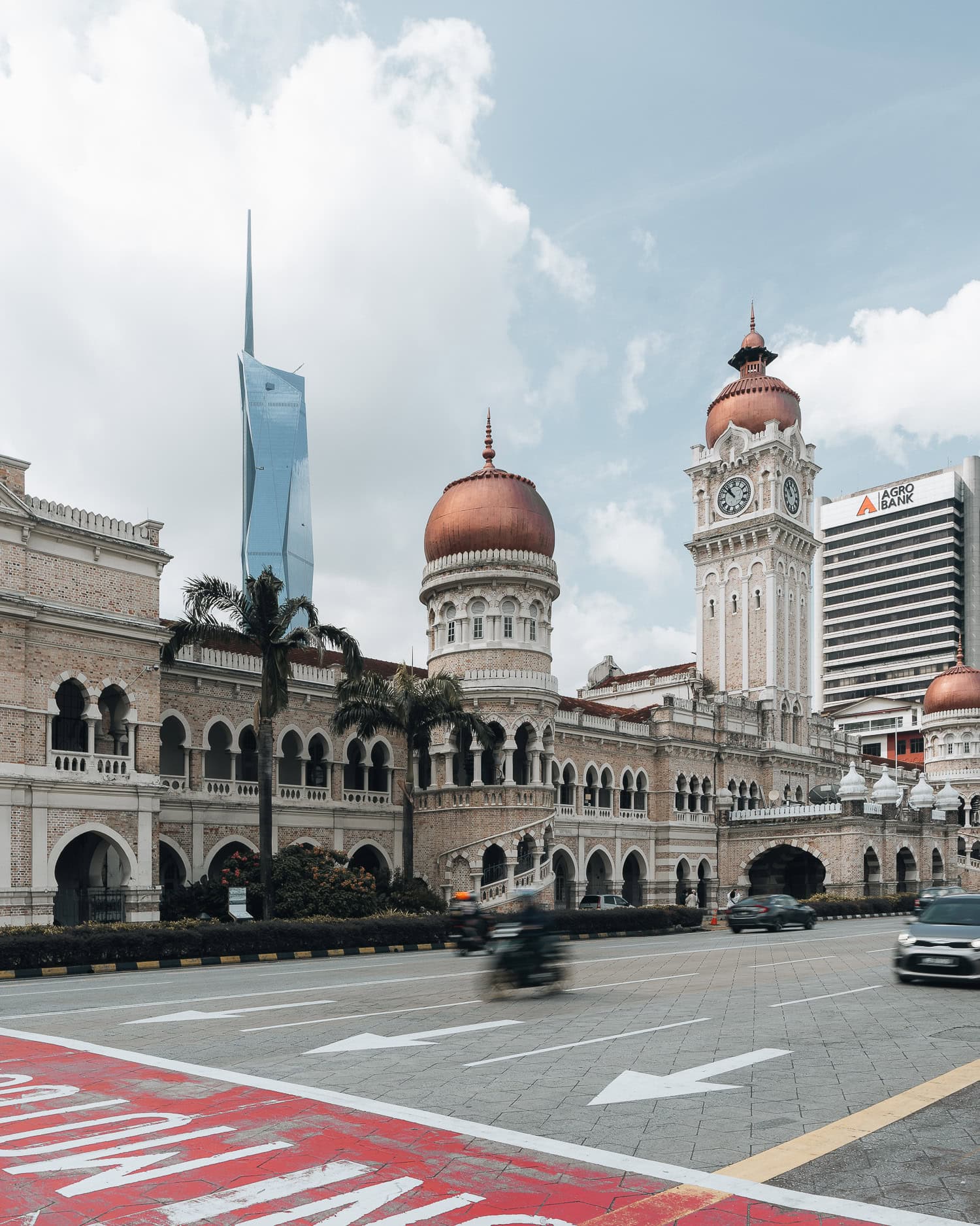 road in malaysia with luxury building