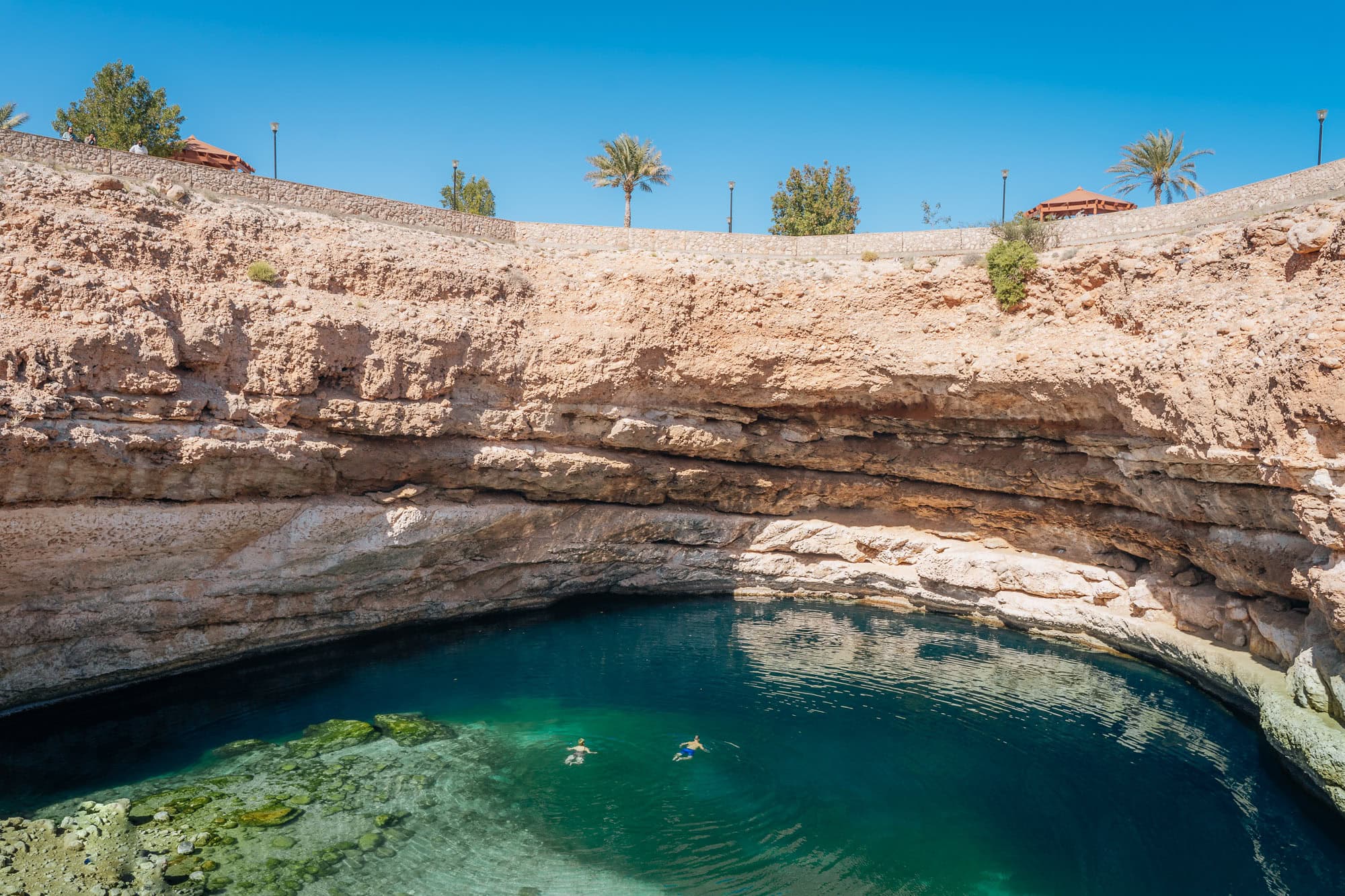 Lake with people swimming in Oman