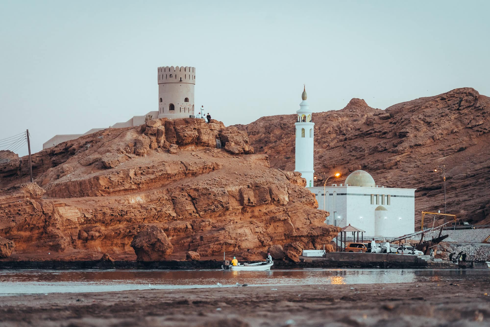 Watch tower and mosque in Sur, Oman during a sunset