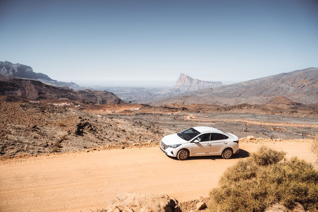 car driving thru in desert