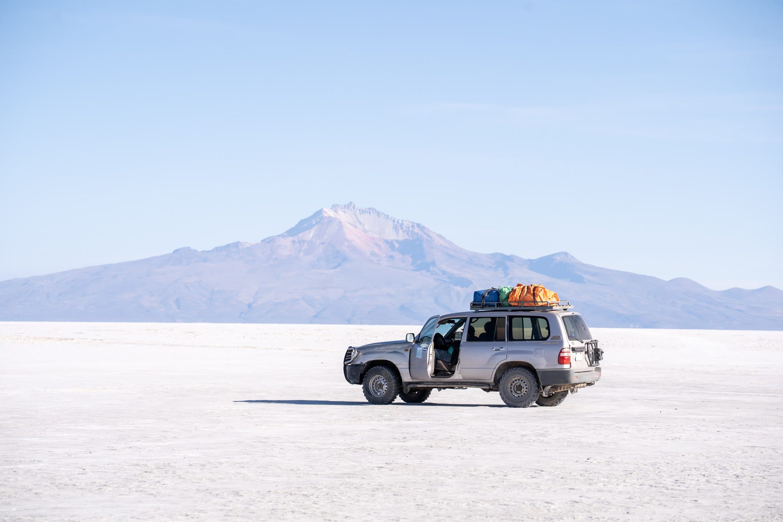 Car on the salt flats of Uyuni, Bolivia