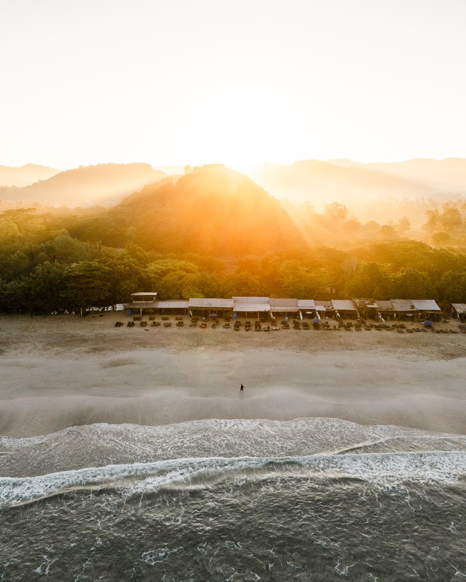 Sunrise glow over a beach in Indonesia
