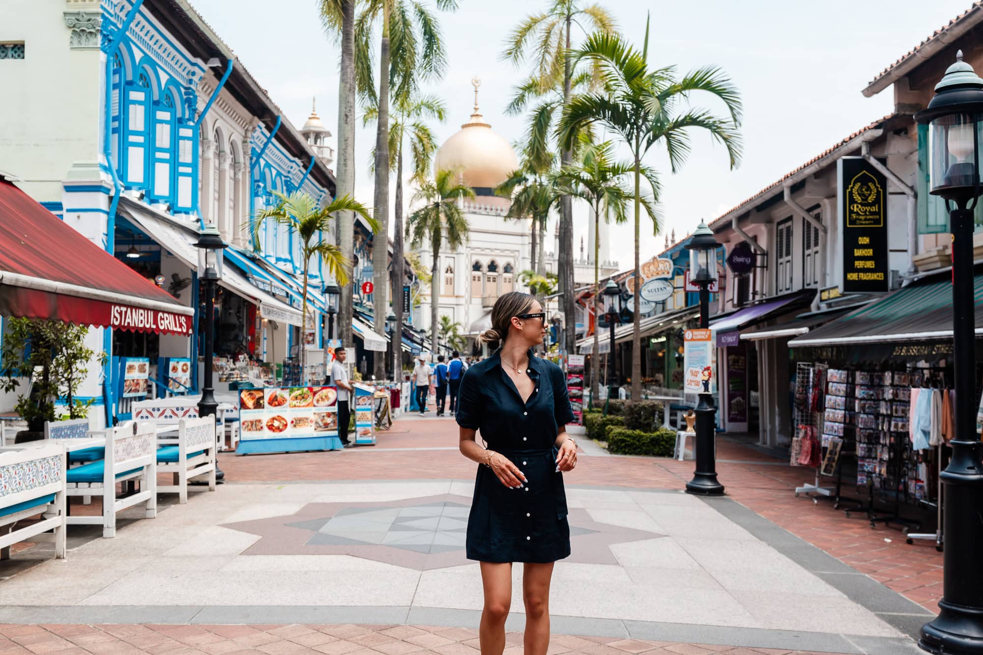 Woman posing in front of mosque in Arab Street, Singapore