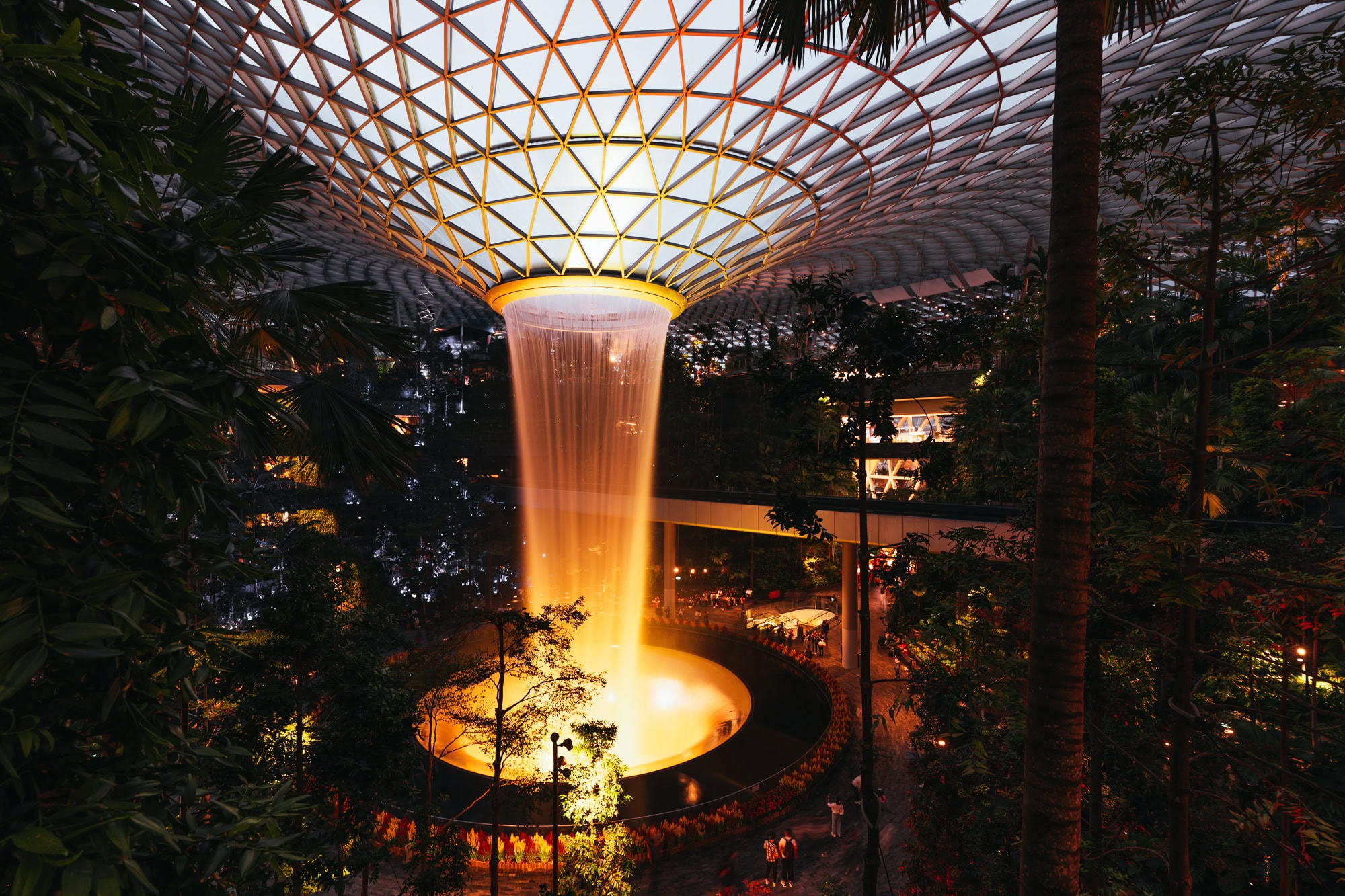 changi airport's indoor waterfall at night