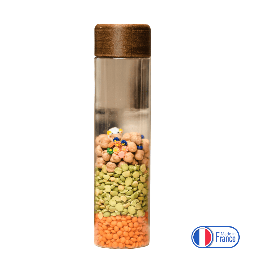 Bouteille sensorielle sonore avec pois chiches et perles