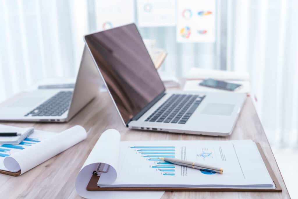 Professional accounting workspace with financial documents and laptop for bookkeeping services.