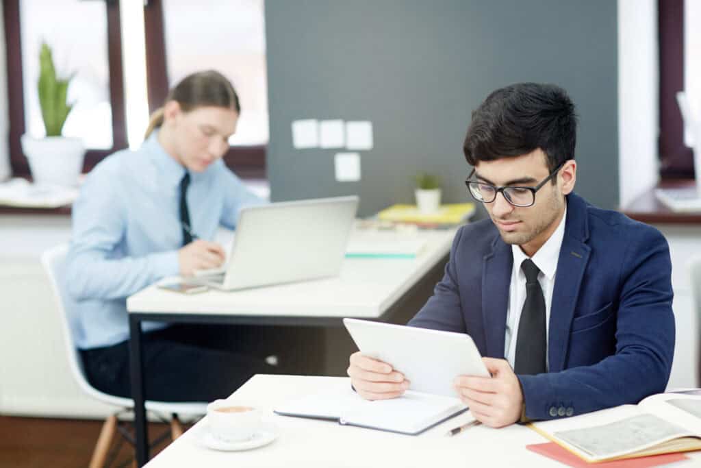 Tax professionals working on financial documents at an accounting firm.
