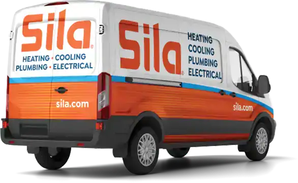 A white and orange Sila service van with branding for heating, cooling, plumbing, and electrical services, along with the website sila.com.