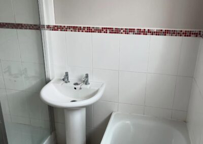 Small bathroom with sink and bathtub