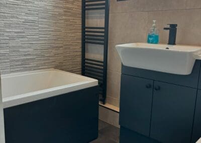 Modern bathroom with sink and freestanding bath