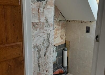 Partially renovated bathroom under construction.