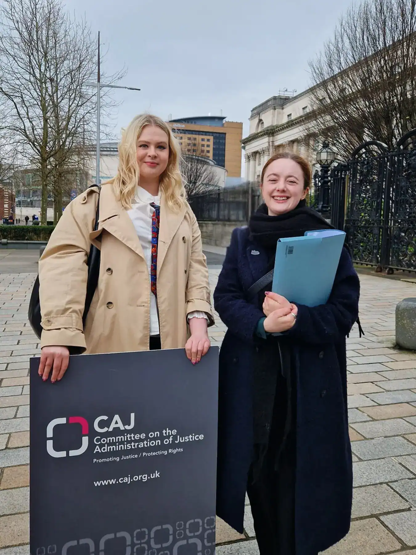 Hannah and Úna from CAJ are smiling directly at the camera.