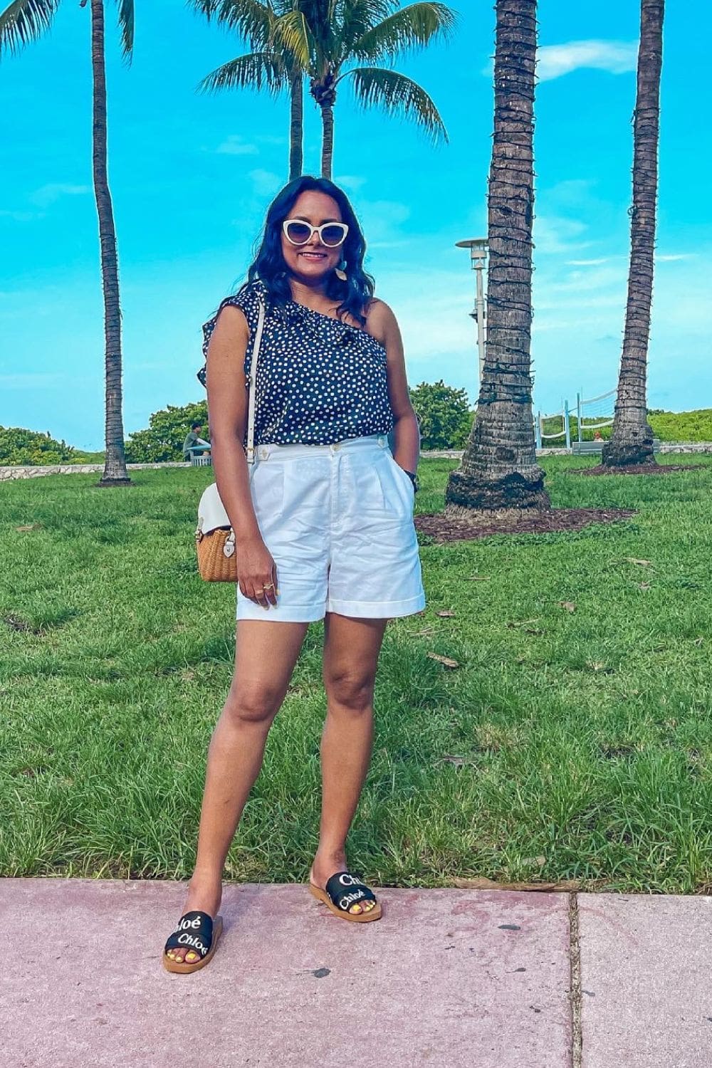 what-to-wear-in-miami-Ruffled-One-Shoulder-Top-White-Shorts-Sandals