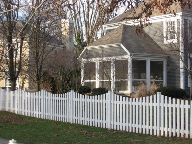 Scalloped white Picket fences