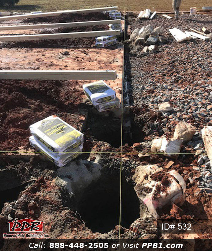 Pole Building Dimensions: 40’ W x 60’ L x 16’ 4” H (ID# 532) 40’ Standard Trusses, 4’ on Center 4/12 Pitch Colors: Two-Tone Siding Color: Upper Color: Slate Lower Color: Charcoal Roofing Color: Charcoal Trim Color: Brite White