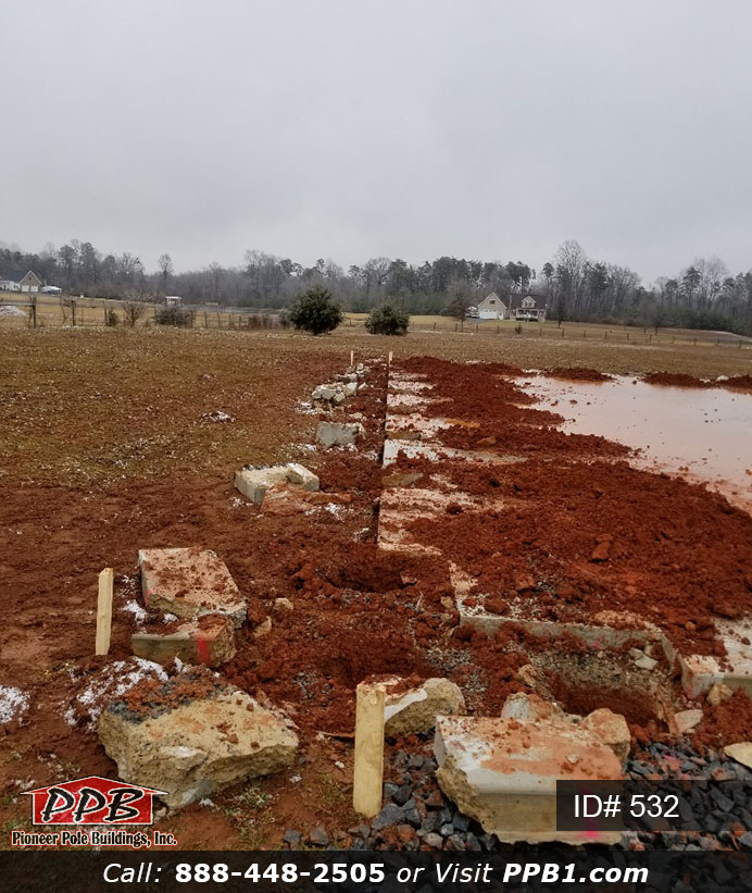 Pole Building Dimensions: 40’ W x 60’ L x 16’ 4” H (ID# 532) 40’ Standard Trusses, 4’ on Center 4/12 Pitch Colors: Two-Tone Siding Color: Upper Color: Slate Lower Color: Charcoal Roofing Color: Charcoal Trim Color: Brite White