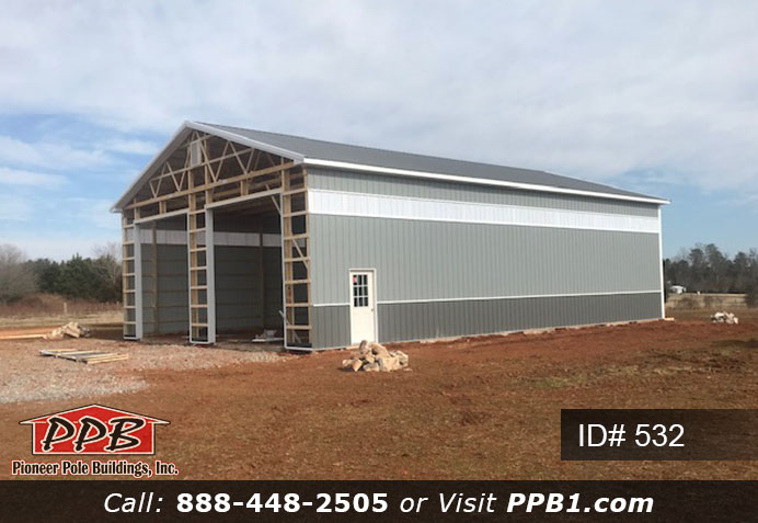 Pole Building Dimensions: 40’ W x 60’ L x 16’ 4” H (ID# 532) 40’ Standard Trusses, 4’ on Center 4/12 Pitch Colors: Two-Tone Siding Color: Upper Color: Slate Lower Color: Charcoal Roofing Color: Charcoal Trim Color: Brite White
