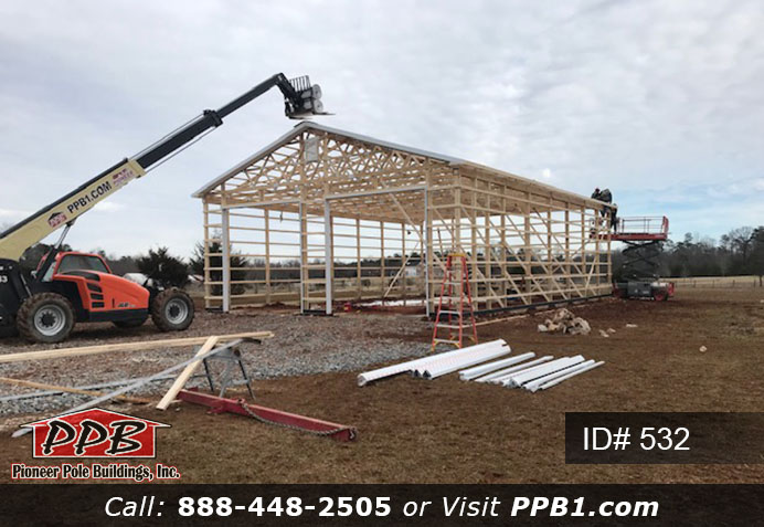 Pole Building Dimensions: 40’ W x 60’ L x 16’ 4” H (ID# 532) 40’ Standard Trusses, 4’ on Center 4/12 Pitch Colors: Two-Tone Siding Color: Upper Color: Slate Lower Color: Charcoal Roofing Color: Charcoal Trim Color: Brite White