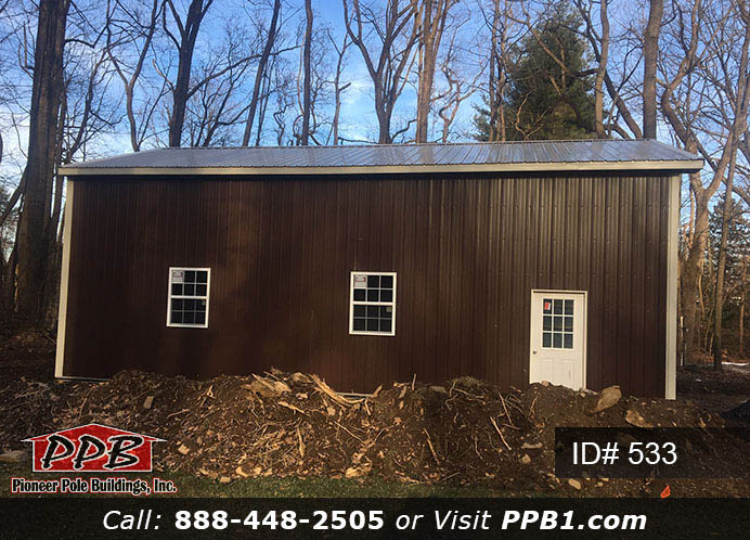 Pole Building Dimensions: 24’ W x 40’ L x 14’ 4” H (ID# 533) 24’ Standard Trusses, 4’ on Center 4/12 Pitch Colors: Siding Color: Brown Roofing Color: Clay Trim Color: Light Stone Openings: (1) 18” x 12” Residential Premium Garage Door with (4) Windows (1) 3068 9-Lite Insulated Entry Door (2) 3’ x 4’ Single-Hung Insulated Windows with Screens & Grids (1) Ceiling Access Door, Color: Bright White