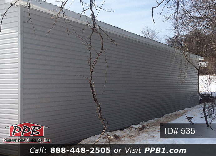 Pole Building Dimensions: 30’ W x 56’ L x 12’ 4” H (ID# 535) 30’ Standard Trusses, 4’ on Center 4/12 Pitch Colors: Siding Color: Sterling Gray (Vinyl Siding) Roofing Color: Black Trim Color: White & Black Openings: (3) 10’ x 8’ Residential Classic Garage Doors with (5) Windows & Hi-Lift (1) 3068 6-Panel Insulated Entry Door (3) 3’ x 4’ Single-Hung Insulated Windows with Screens & Grids