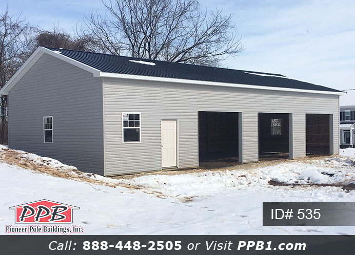 Pole Building Dimensions: 30’ W x 56’ L x 12’ 4” H (ID# 535) 30’ Standard Trusses, 4’ on Center 4/12 Pitch Colors: Siding Color: Sterling Gray (Vinyl Siding) Roofing Color: Black Trim Color: White & Black Openings: (3) 10’ x 8’ Residential Classic Garage Doors with (5) Windows & Hi-Lift (1) 3068 6-Panel Insulated Entry Door (3) 3’ x 4’ Single-Hung Insulated Windows with Screens & Grids