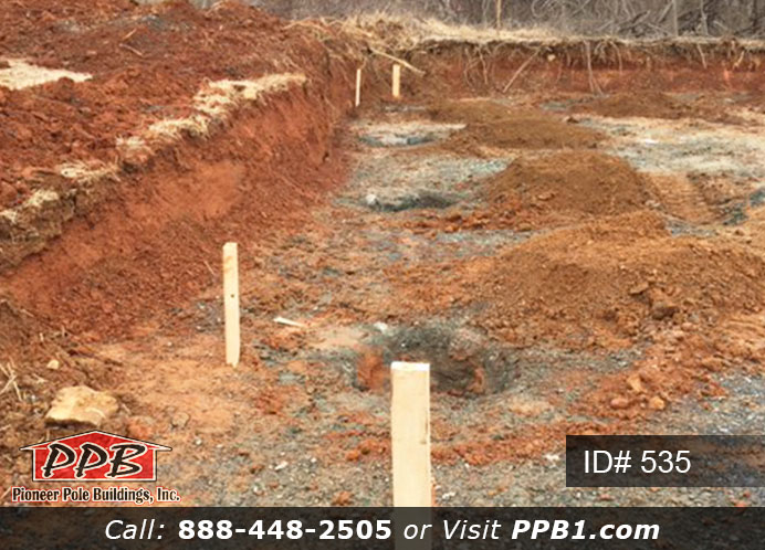Pole Building Dimensions: 30’ W x 56’ L x 12’ 4” H (ID# 535) 30’ Standard Trusses, 4’ on Center 4/12 Pitch Colors: Siding Color: Sterling Gray (Vinyl Siding) Roofing Color: Black Trim Color: White & Black Openings: (3) 10’ x 8’ Residential Classic Garage Doors with (5) Windows & Hi-Lift (1) 3068 6-Panel Insulated Entry Door (3) 3’ x 4’ Single-Hung Insulated Windows with Screens & Grids