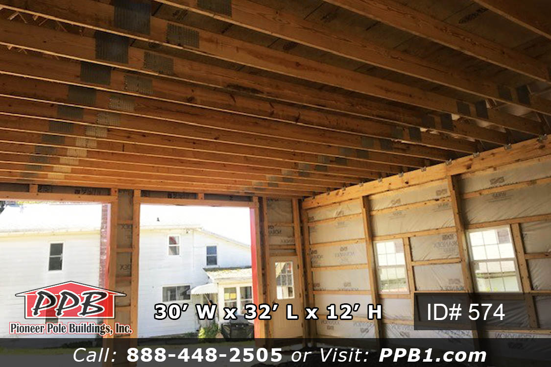 30’ W x 32’ L x 12’ H A Gambrel Garage with a Second Floor 30’ Gambrel Trusses, 2’ on Center Colors: Siding Color: Beige Roofing Color: Ash Gray Trim Color: Red