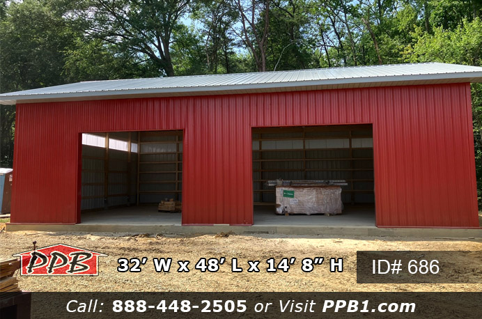 This is a thirty-two foot wide by forty-eight foot long red garage with two twelve foot wide by ten foot high garage doors on the front eave. There two foot overhangs around the whole garage with a fourteen foot high ceiling height. The roof color is slate with red siding and it has storage space on each sides of the garage doors after the cars or trucks are parked inside.