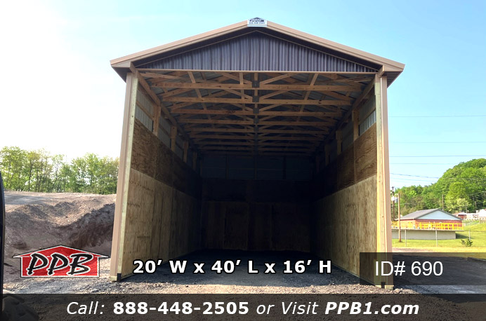 This is a twenty foot wide by forty foot long brown material building with a sixteen foot high ceiling height. This building has an open front gable to get the stone, salt or any other material in and out with a loader or machine. There is one foot overhangs around the whole three-sided building. The metal roof color is tan with brown siding. This building has no entry door other than the open front gable.