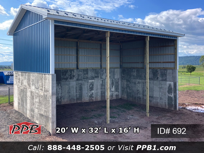This is a twenty foot wide by thirty-two foot long ocean blue building with a sixteen foot high ceiling height. This building has no garage doors, it has the front thirty-two foot long eave open for material storage. There is one foot overhangs around the whole building. The metal roof color is slate with white trim.