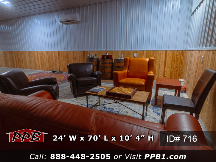 Siding area with a concrete floor and knotty pine up the wall four feet with metal liner panel the rest of the way up the wall.