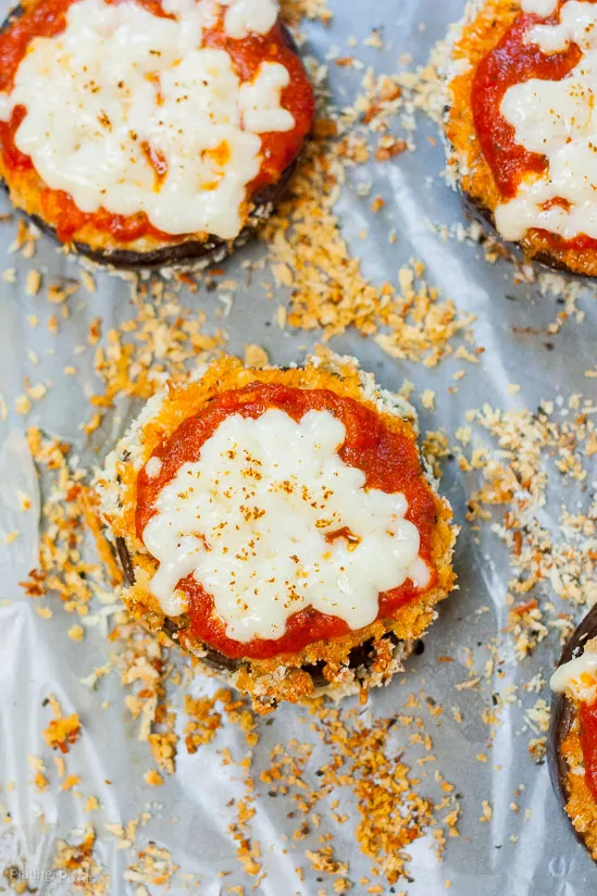 Eggplant slices topped with cheese and marinara sauce, baked to perfection.