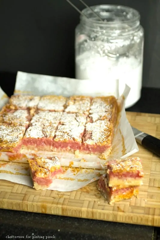 Cherry Limeade bars with pink filling and powdered sugar, perfect for summer desserts.