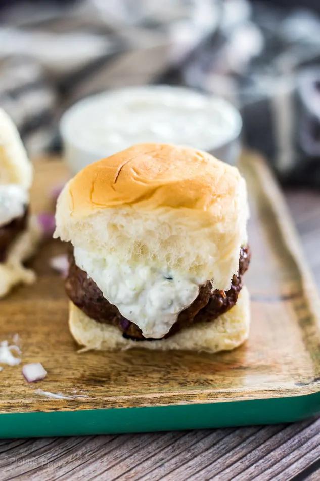 Mini gyro sliders with homemade tzatziki, perfect for appetizers or snacks.
