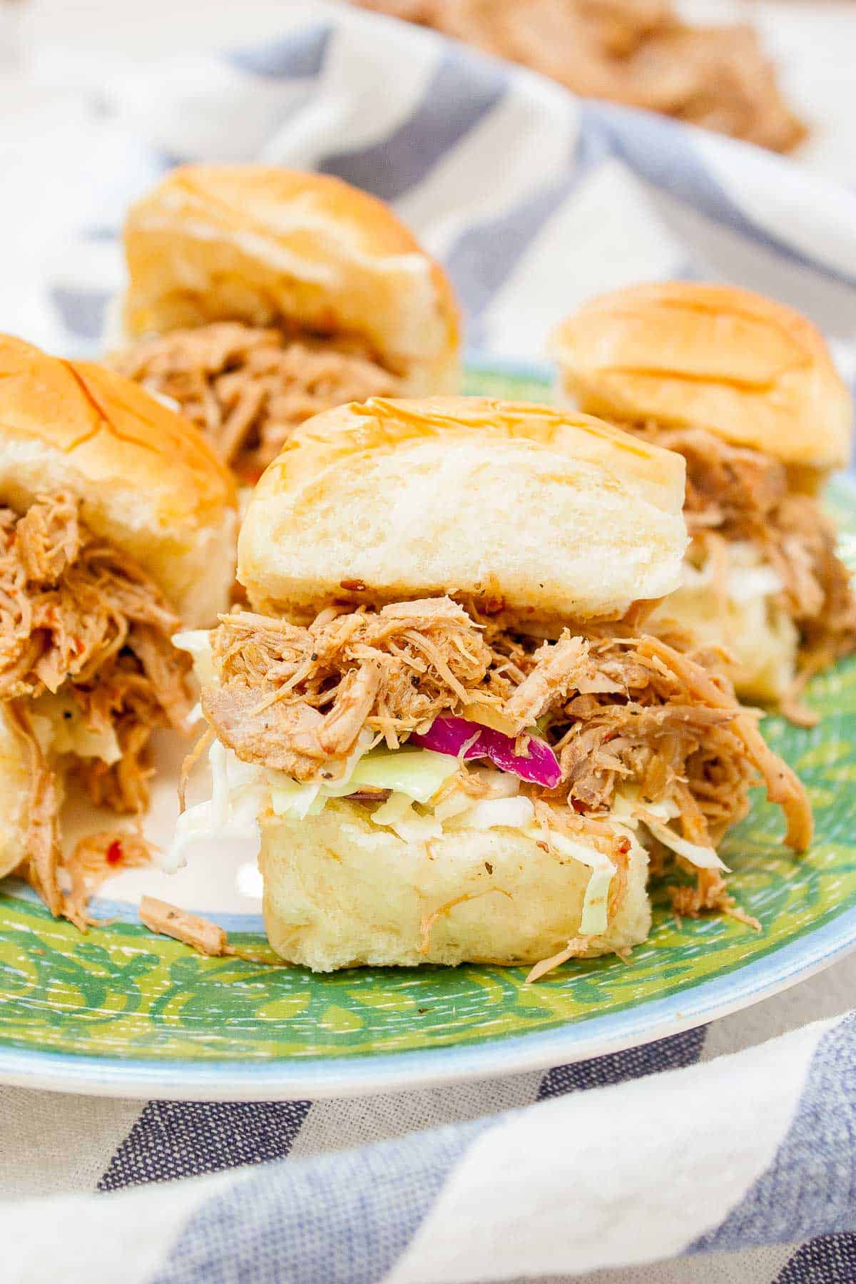 Carolina Style Slow Cooker Pulled Pork sliders with coleslaw on plate