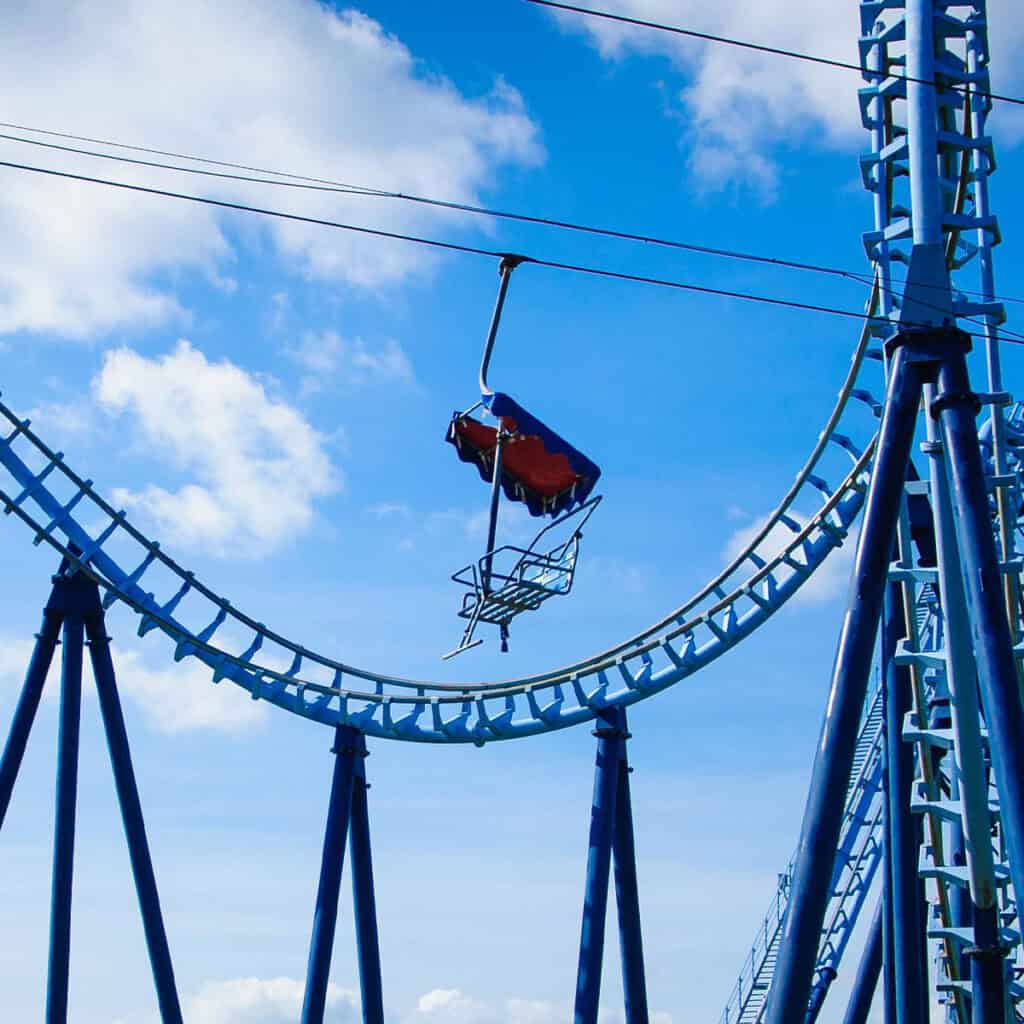 Chairlift ride in front of a rollercoaster