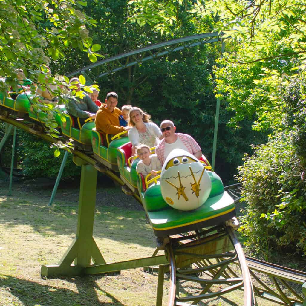 People on an egg-themed rollercoaster