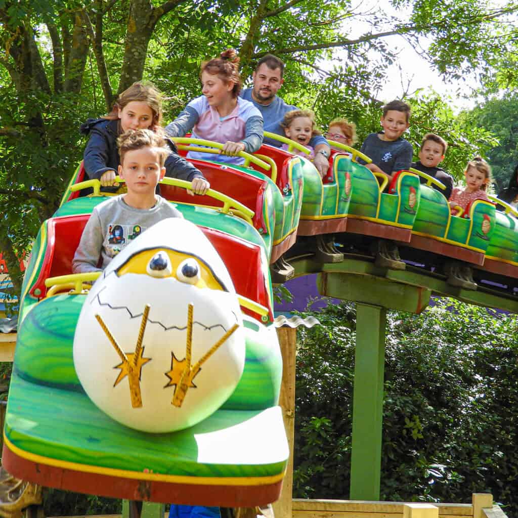 People on an egg-themed rollercoaster