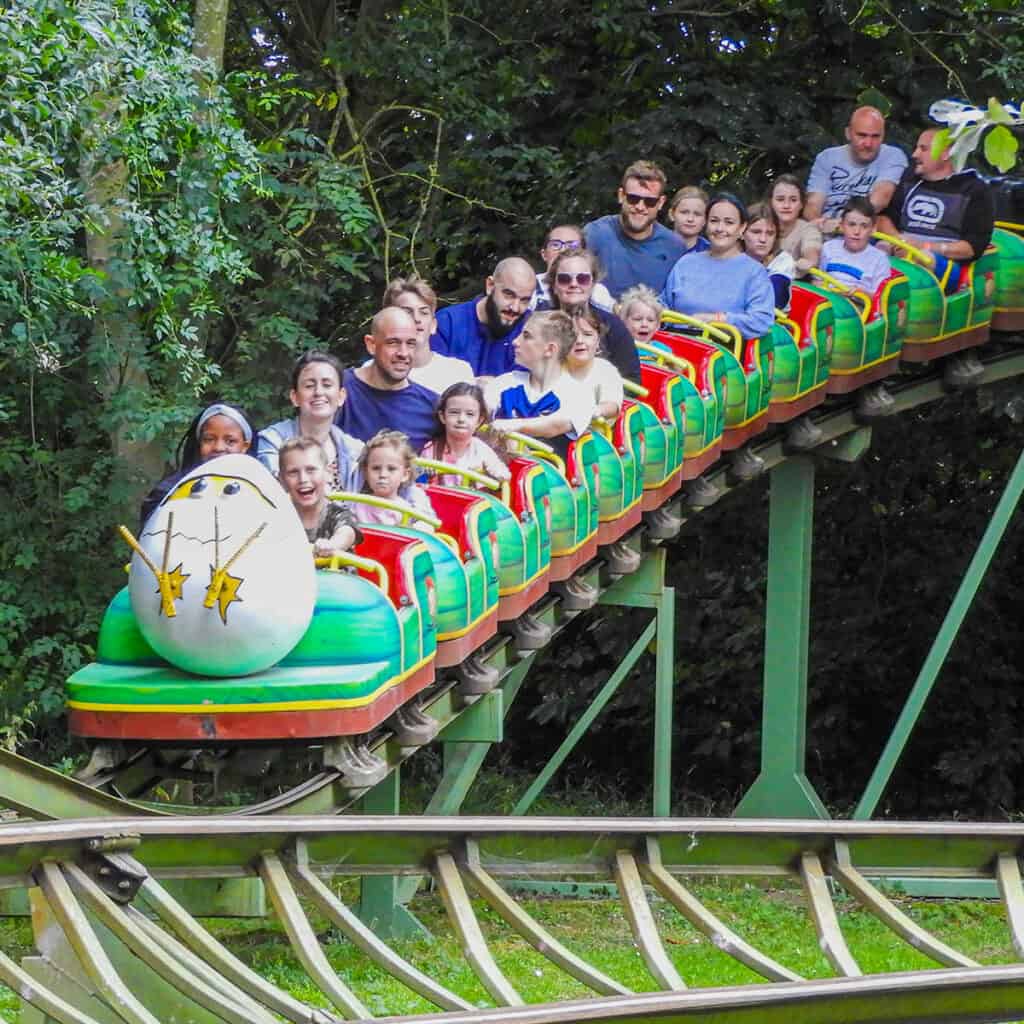 People on an egg-themed rollercoaster
