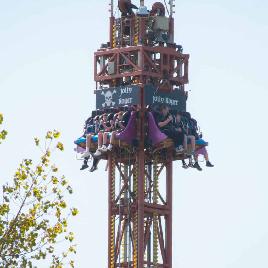 People on a drop tower theme park ride