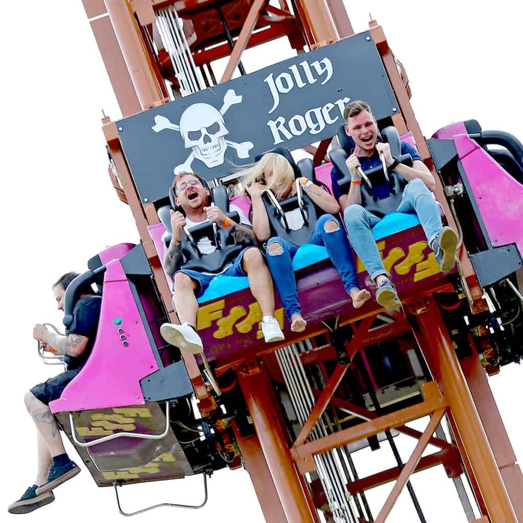 People on a drop tower theme park ride freefalling