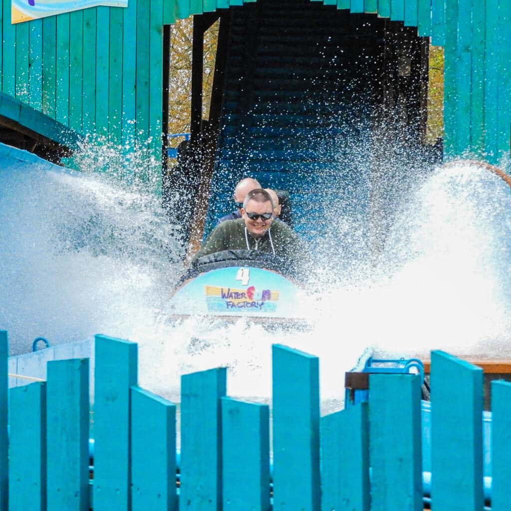 People on a log flume water ride