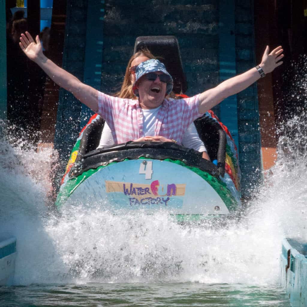 People on a log flume water ride