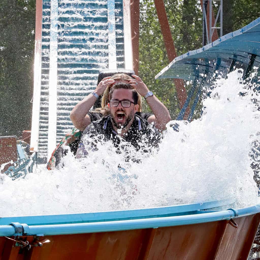 People on a log flume water ride