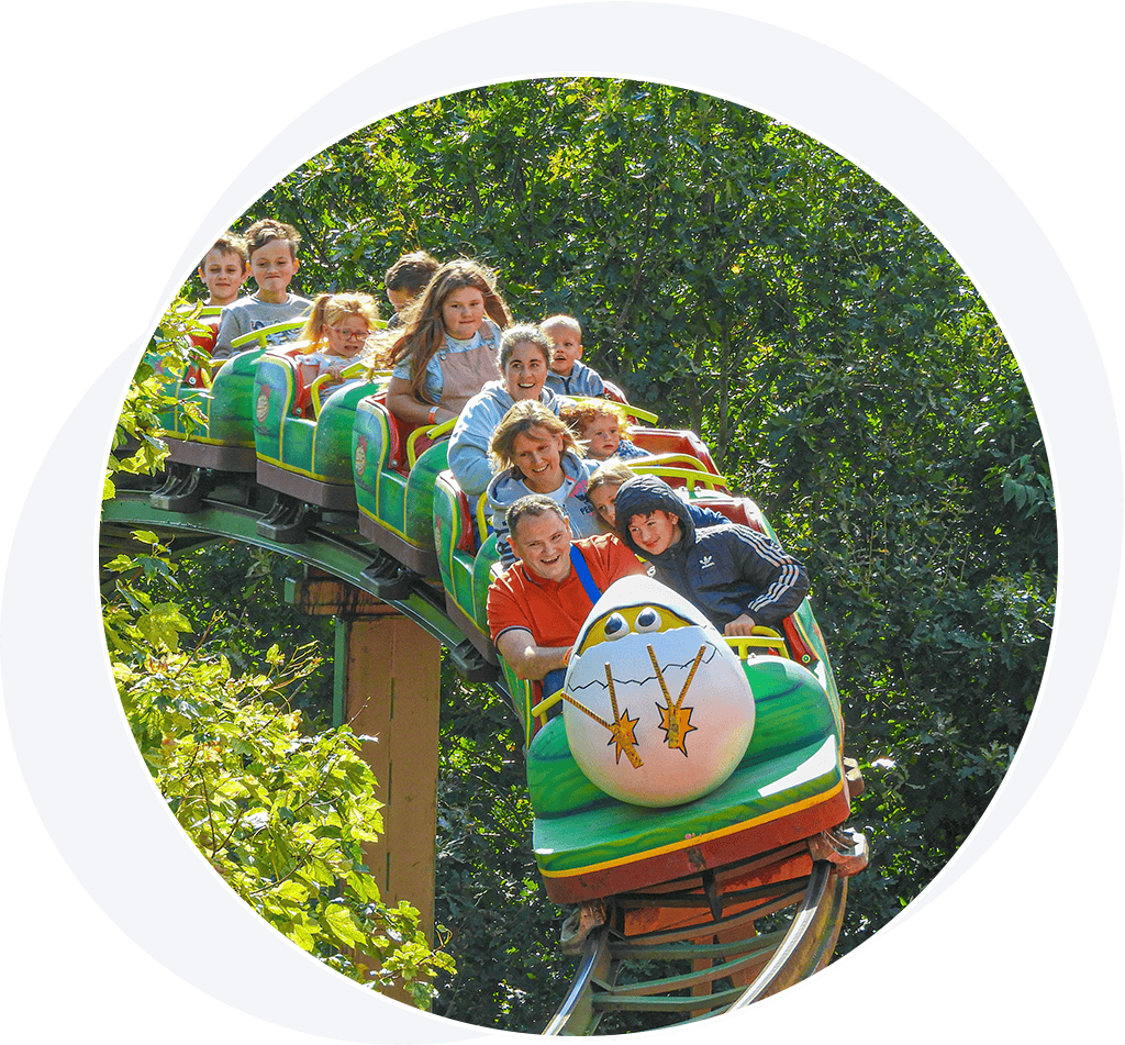 People on an egg-themed roller coaster