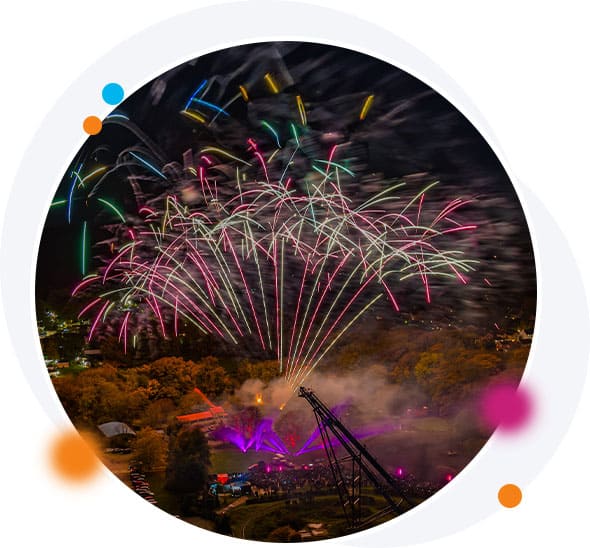 Firework display over theme park