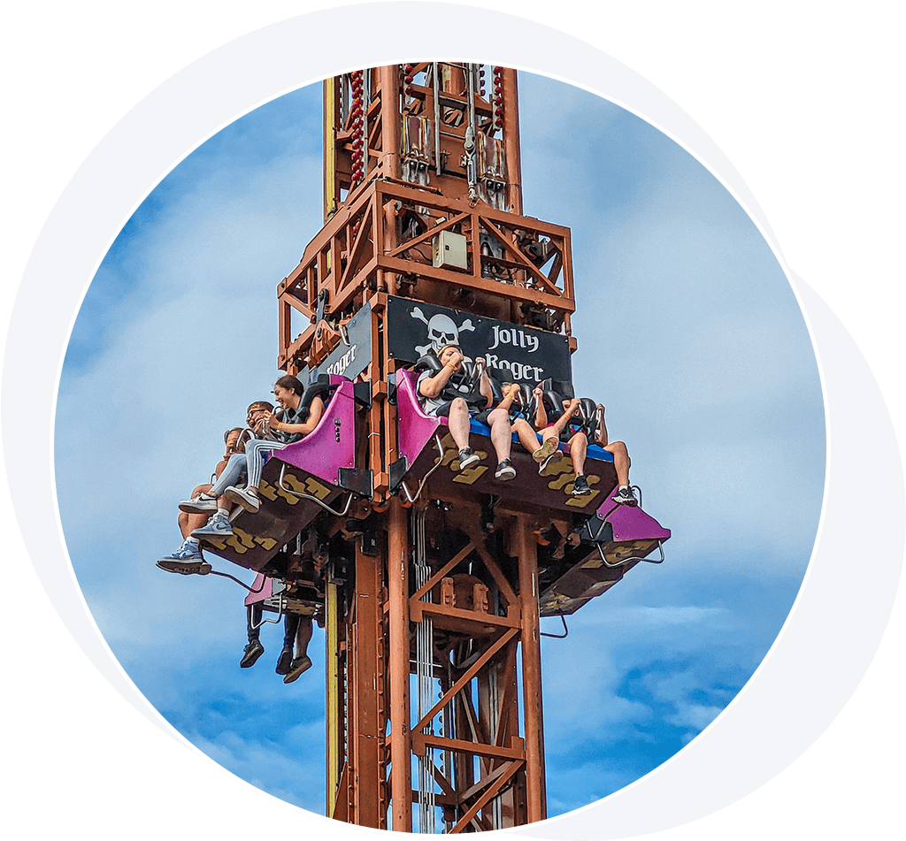 People on board a pirate themed theme park drop tower thrill ride